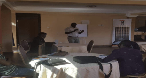 Facilitator taking the participants through the session in Kampala District